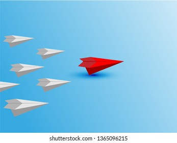 Leadership concept with red paper plane leading among white on blue background