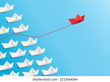 Concepto de liderazgo con un barco de papel rojo liderando entre blanco sobre fondo azul.