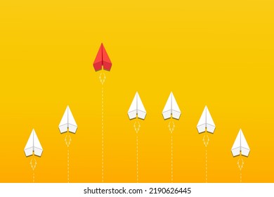 Leadership. Different thinking concept. The red paper plane leaves the group of white on yellow background. Business concept for new ideas creativity, innovative solution.