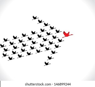 Leadership and Synergy Concept Illustration : A number of Swans flying against a Bright White sky background lead by a big dark leader swan - Silhouette