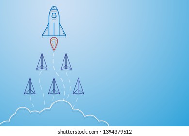 Leadership, teamwork and courage concept, Rocket for leader and paper planes flying follow rocket leader on sky.