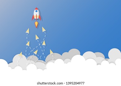 Leadership, teamwork and courage concept, Rocket for leader and paper planes flying follow rocket leader on sky.