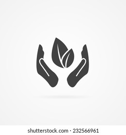 Leaf between two hands simple gray flat icon. Shadow and white background.