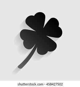 Leaf clover sign. Black paper with shadow on gray background.