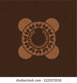 leaf crown icon inside badge with wooden background