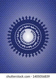 leaf crown icon inside badge with denim background