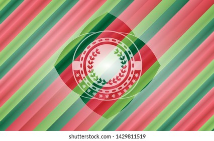 leaf crown icon inside christmas colors style badge.