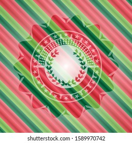 leaf crown icon inside christmas colors style emblem.