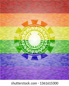 leaf crown icon inside emblem on mosaic background with the colors of the LGBT flag