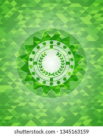 leaf crown icon inside green emblem. Mosaic background