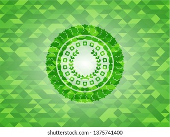 leaf crown icon inside green emblem with triangle mosaic background
