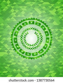 leaf crown icon inside green emblem with mosaic ecological style background