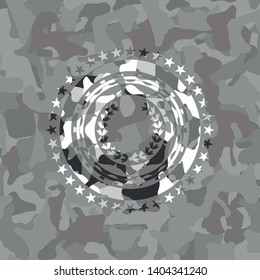 leaf crown icon inside grey camouflaged emblem