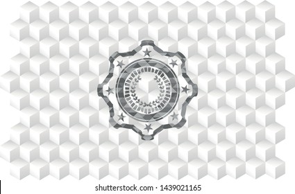 leaf crown icon inside grey emblem with geometric cube white background