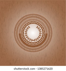 leaf crown icon inside wooden emblem