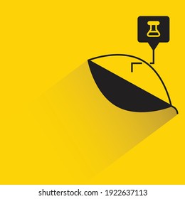 leaf and flask with shadow on yellow background