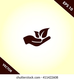 leaf in hand icon. vector eps10 icon
