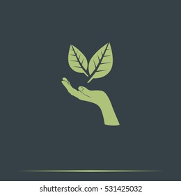 Leaf in a hand sign of environmental protection icon. Eco sign.