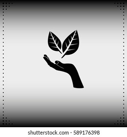 Leaf in a hand sign of environmental protection icon. Eco sign.