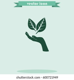 Leaf in a hand sign of environmental protection icon. Eco sign.