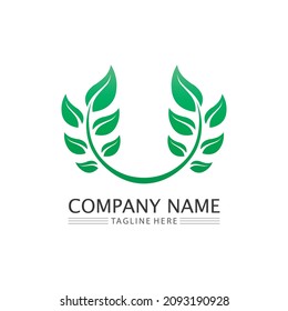 LOGOTIPO DE ÁRBOL NATURAL Y DE HOJA PARA EL ICONO DE DISEÑO ECOLÓGICO DE LA PLANTA VERDE DEL VECTOR DE NEGOCIOS
