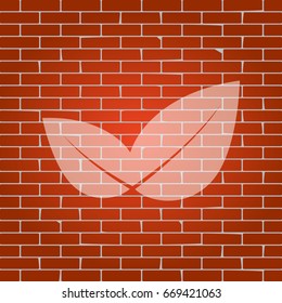 Leaf sign illustration. Vector. Whitish icon on brick wall as background.