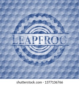 Leapfrog blue badge with geometric pattern background.