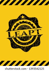 Leapt black grunge emblem inside yellow warning sign. Vector Illustration. Detailed.