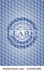 Learn blue badge with geometric pattern.
