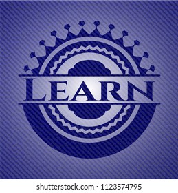 Learn emblem with jean background