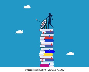 Learning or education goals. woman with target standing on high pile of books