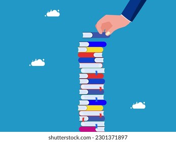 Learning or higher education. Businessman hand placing books on high pile of books