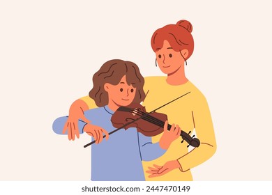 Learning to play violin for teenage girl, from professional teacher who helps to hold bow correctly. Caring mother teaches daughter to perform music on violin, practicing before concert with audience