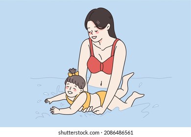 Learning to swim and happy parenthood concept. Smiling young woman mother in swimwear standing holding teaching small daughter to swim vector illustration 