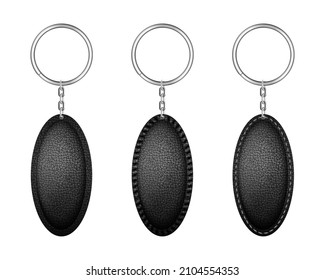 Leather oval keychain, holder trinket for key with metal ring. Vector realistic template of black fob for home, car or office isolated on white background. Blank accessory for corporate identity