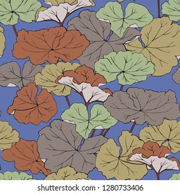The leaves of geranium multi colored on a blue background. Seamless vector pattern.