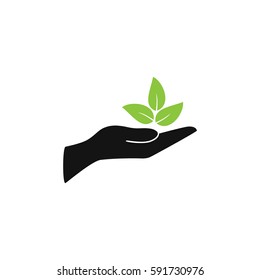 Leaves in a hand sign of environmental protection icon. Eco sign. vector illustration.