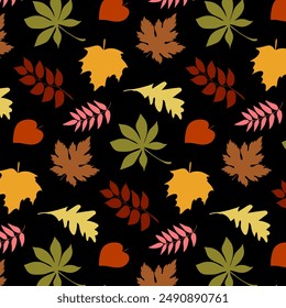 Leaves on a black background.Vector seamless pattern with autumn leaves on a black background.