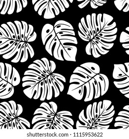 Leaves of palm, monstera. Jungle seamless pattern. Use on fake wallpapers, textiles, in the interior