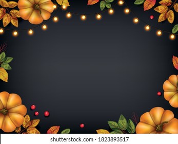 Аutumn leaves with pumpkins, holiday lights on blackboard. Seasonal and holidays concept for advertising, invitation, greeting card