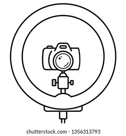 LED ring light with stand and camera. Photographic studio. Vector outline icon isolated on white background.