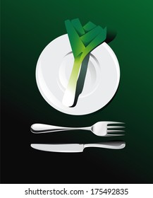 leek on a plate with cutlery for a healthy diet