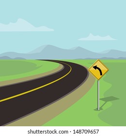 left curve road and left turn road sign, on green landscape with mountains 
