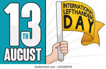 Left hand holding a yellow flag and reminder date to celebrate International Left-handers Day this 13th August.