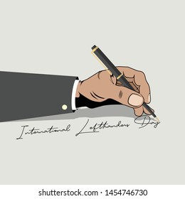 left hand writing "international lefthanders day" with a ballpoint, which is celebrated on August 13