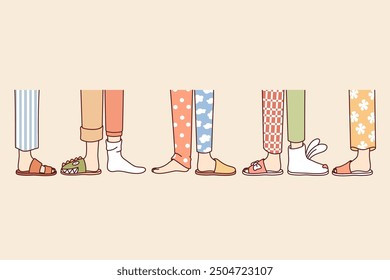 Legs of people from pajama party, in different pants and slippers, attending themed holiday for friends. Children pajama party for classmates of students in same school, to find new friends