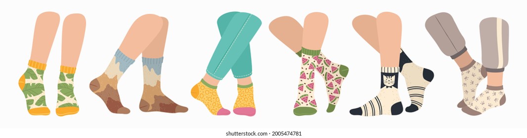 Legs in socks. Women and men wearing fashionable socks. Flat cartoon colorful sock with trendy pattern on feet, fashion accessories vector set. Clothing pieces, garment for winter season