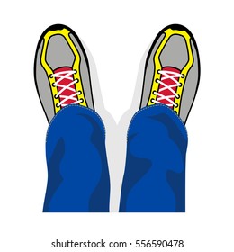 Legs in sports shoes the top view.