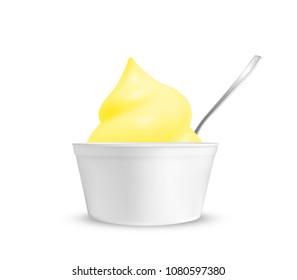 Lemon ice cream in a cup with a spoon.