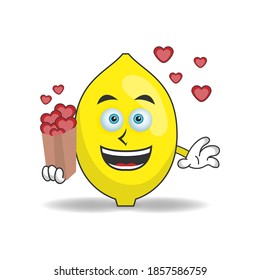Lemon mascot character holding a love icon. vector illustration